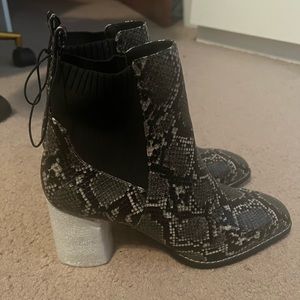 Snake print heeled boots